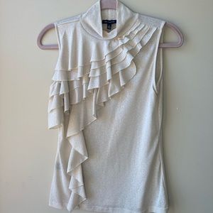 Cream ruffled blouse. Sleeveless mock turtleneck.